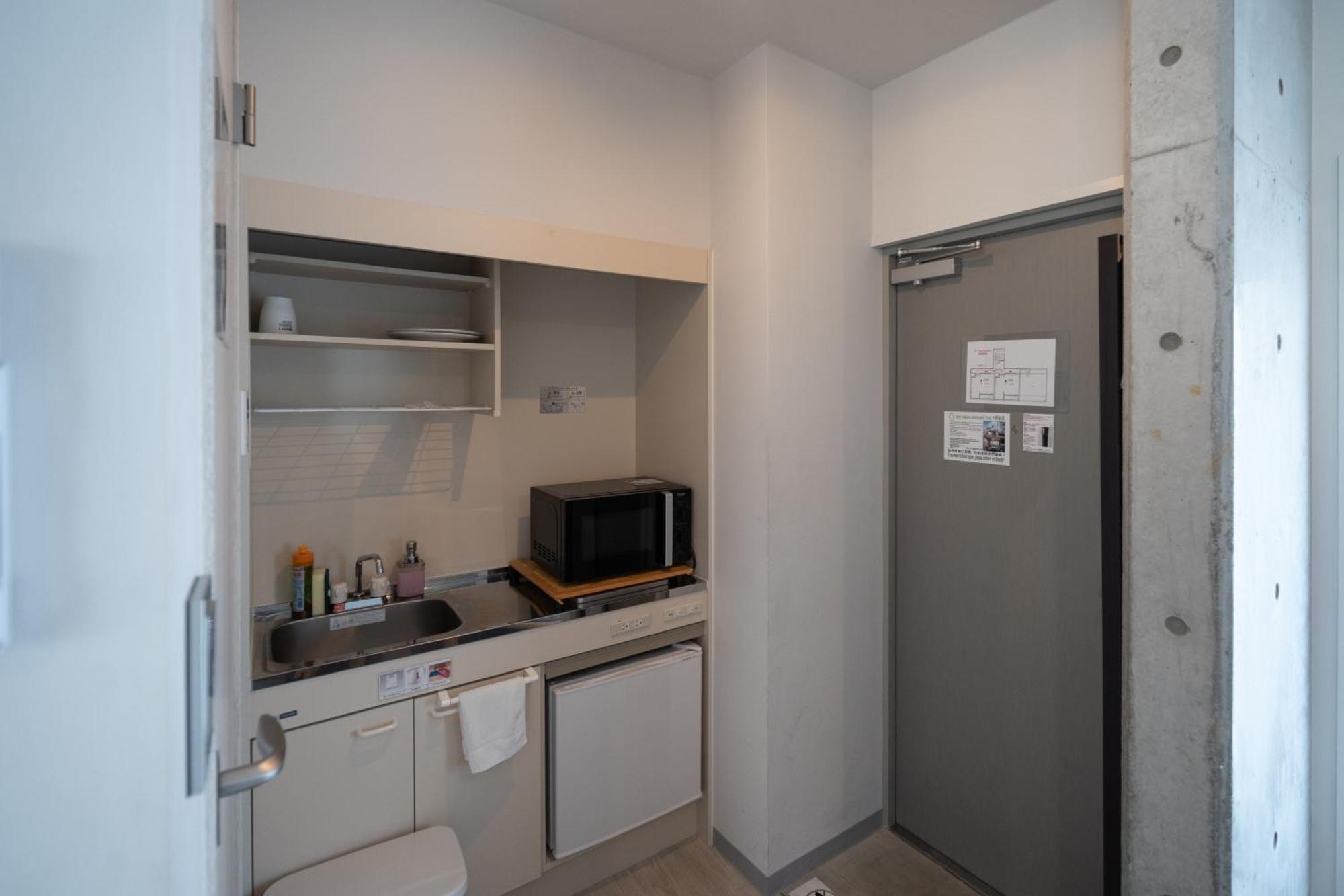 Апартаменты Bmj Shinjuku Okubo Токио Номер фото